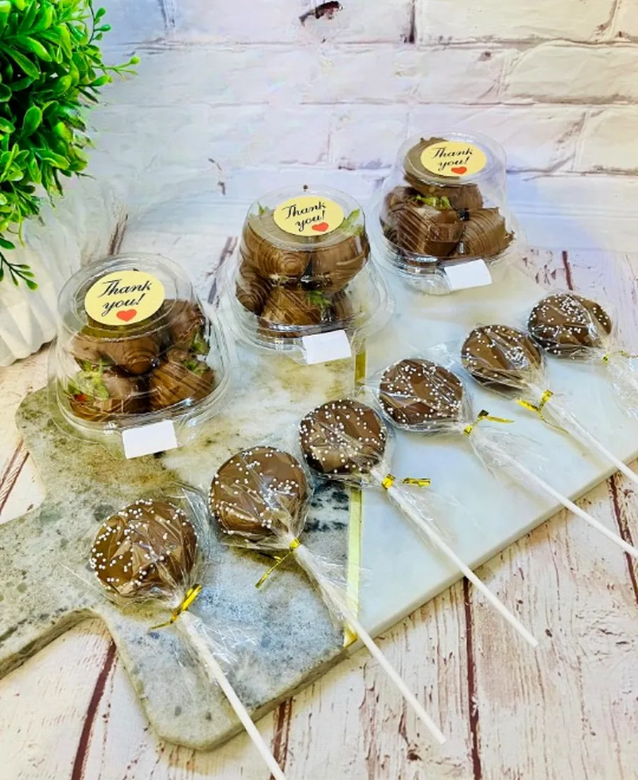 Candy apples and dipped treats wrapped with thank-you stickers