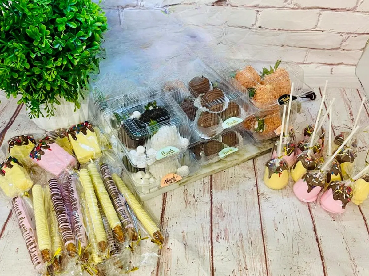 Chocolate-dipped pretzel rods and dipped treats on sticks wrapped for gifting